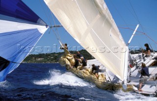 Maxi yacht powering down wind in strong breeze