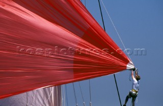 Bowman prepares to release spinnaker before a sail change