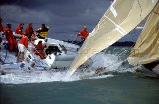 Racing yacht broaches in strong winds