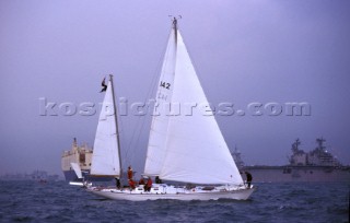 Gipsy Moth having undergone restoration sailing once again in 2005 during Trafalgar 200. Gipsy Moth IV under sail in the Solent at the Fleet Review in June 2005