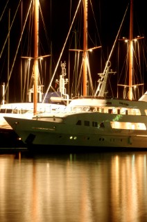 Superyachts moored at night in Palma, Mallorca