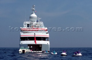 Four Jet Skis behind motoryacht at anchor