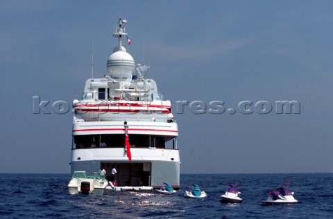 Four Jet Skis behind motoryacht at anchor