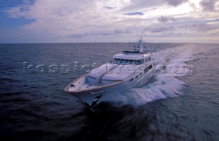 Motor yacht speeding through the water