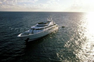 Cruising superyacht Southern Cross 3 at anchor in a quiet anchorage mooring in the Bahamas