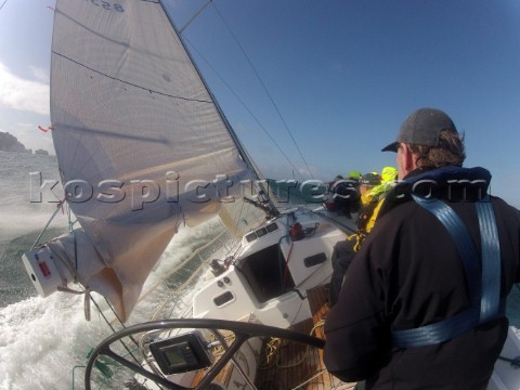 Helmsman driving upwind in rough seas onboard the Norwegian J133 Madjus during the JP Morgan Round t