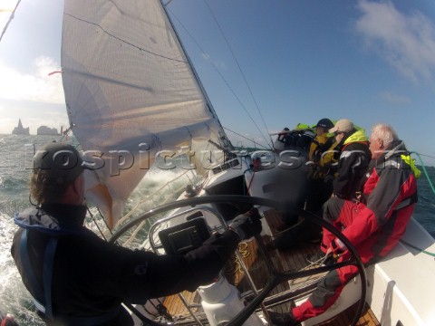 Helmsman driving upwind in rough seas onboard the Norwegian J133 Madjus during the JP Morgan Round t