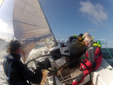 Helmsman driving upwind in rough seas onboard the Norwegian J133 Madjus during the JP Morgan Round t