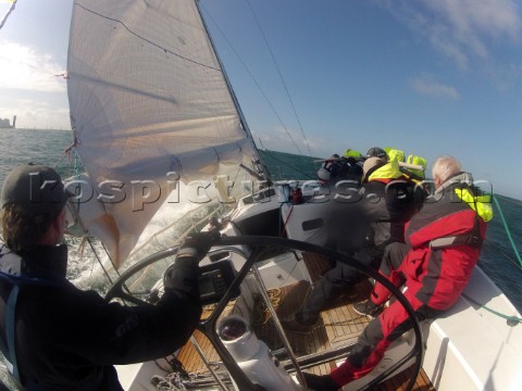 Helmsman driving upwind in rough seas onboard the Norwegian J133 Madjus during the JP Morgan Round t