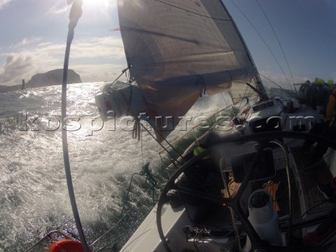 Helmsman driving upwind in rough seas onboard the Norwegian J133 Madjus during the JP Morgan Round t