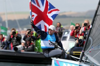 WEYMOUTH, ENGLAND - AUGUST 5th: Ben Ainslie of Great Britain wins Gold Medal in the Mens Finn sailing dinghy class at the London 2012 Olympic Games at Weymouth Harbour on August 5th, 2012 in Weymouth, England.