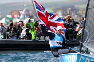 WEYMOUTH, ENGLAND - AUGUST 5th: Ben Ainslie of Great Britain wins Gold Medal in the Mens Finn sailing dinghy class at the London 2012 Olympic Games at Weymouth Harbour on August 5th, 2012 in Weymouth, England.