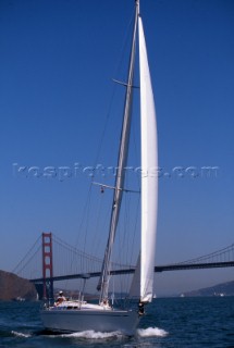 Nautor Swan boat sailing in front of the Golden Gate Bridge, San Francisco, USA.