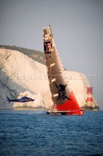 PORTSMOUTH, UNITED KINGDOM - JUNE 2:  Pirates of the Caribean lost her lead after the start and was fourth boat to pass the needles on their way to Rotterdam in the light winds. A press heliopter flies in to get a good shot. The Volvo fleet leave Portsmouth and sail through the Solent on Leg 8 of the Volvo Ocean Race 2005-2006 around the United Kingdom to Rotterdam, Holland. The overall event has already been won by Mike Sanderson on ABN AMRO ONE with two legs remaining.