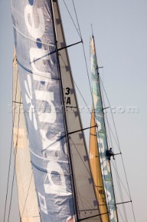 PORTSMOUTH, UNITED KINGDOM - JUNE 2: A crew man on ABN Amro One is sent up the mast to look for wind as they sail ahead of the next competing yacht Brunel. The Volvo fleet leave Portsmouth and sail through the Solent on Leg 8 of the Volvo Ocean Race 2005-2006 around the United Kingdom to Rotterdam, Holland. The overall event has already been won by Mike Sanderson on ABN AMRO ONE with two legs remaining.