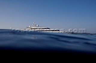 Superyacht moving across a calm sea