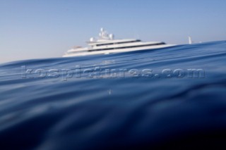 Superyacht moving across a calm sea