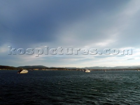 Superyachts at anchor in wind in the Mediterranean