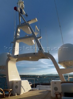 Superyacht in the Mediterranean. Navigation mast with Furnuo radar and communication aerials and satcom dishes