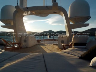 Superyacht in the Mediterranean. Navigation mast with Furnuo radar and communication aerials and satcom dishes