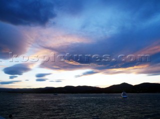 Superyacht with storm clouds in the Mediterranean