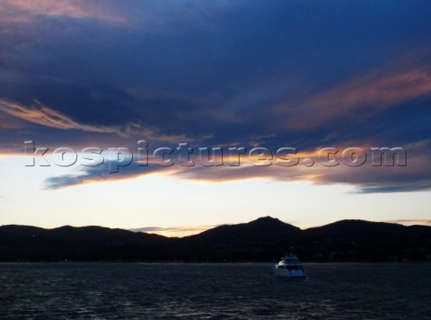 Superyacht with storm clouds in the Mediterranean