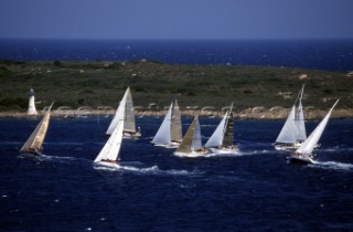 Fleet of Swan yachts racing through the Maddalena Islands off Port Cervo Sardinia during the Rolex Swan World Cup