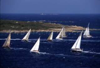 Fleet of Swan yachts racing through the Maddalena Islands off Port Cervo Sardinia during the Rolex Swan World Cup