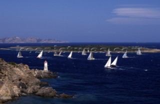 Fleet of Swan yachts racing through the Maddalena Islands off Port Cervo Sardinia during the Rolex Swan World Cup