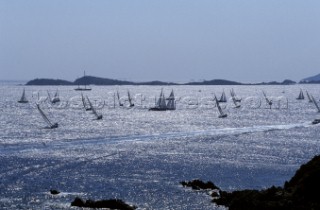 Fleet of Swan yachts racing through the Maddalena Islands off Port Cervo Sardinia during the Rolex Swan World Cup