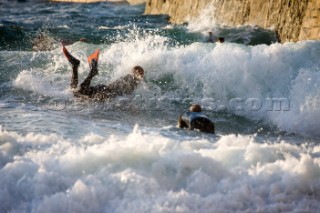 Body Boarding in the surf on the beach in St Ives in Cornwall, UK.