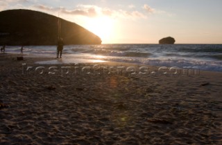 Fisherman with fishing rod on the beach