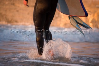 Body Boarding in the surf on the beach in St Ives in Cornwall, UK.