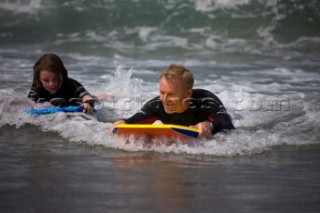 Body Boarding in the surf on the beach in St Ives in Cornwall, UK.