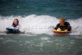 Body Boarding in the surf on the beach in St Ives in Cornwall, UK.