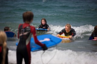 Body Boarding in the surf on the beach in St Ives in Cornwall, UK.