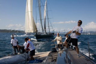 SAINT-TROPEZ, FRANCE - October 5th: The crew onboard the Wally maxi yacht Dangerous But Fun of Monaco owned by Michelle Perris trim the spinnaker to stay ahead of Nariida (Norway) on October 5th 2006. Dangerous But Fun crossed the finish in 2nd place. The largest classic and modern yachts from around the world gather in Saint-Tropez annually for a week of racing and festivities to mark the end of the Mediterranean season, before heading across the Atlantic to winter in the Caribbean.