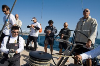 SAINT-TROPEZ, FRANCE - October 5th: The crew onboard the Wally maxi yacht Dangerous But Fun of Monaco owned by Michelle Perris all synchronise their watches before the start of racing on October 5th 2006. It is vital that the yacht crosses the startline the split-second the gun goes. Dangerous But Fun had a good start and crossed the finish in 2nd place. The largest classic and modern yachts from around the world gather in Saint-Tropez annually for a week of racing and festivities to mark the end of the Mediterranean season, before heading across the Atlantic to winter in the Caribbean.