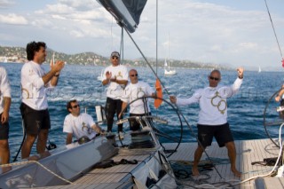 SAINT-TROPEZ, FRANCE - October 5th: The crew onboard the Wally maxi yacht Dangerous But Fun of Monaco owned by Michelle Perris celebrate nand congratulate each other on coming second in the race on October 5th 2006. The largest classic and modern yachts from around the world gather in Saint-Tropez annually for a week of racing and festivities to mark the end of the Mediterranean season, before heading across the Atlantic to winter in the Caribbean.