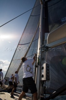 SAINT-TROPEZ, FRANCE - October 5th: The crew onboard the Wally maxi yacht Dangerous But Fun of Monaco owned by Michelle Perris hoist the code zero spinnaker during racing on October 5th 2006. The largest classic and modern yachts from around the world gather in Saint-Tropez annually for a week of racing and festivities to mark the end of the Mediterranean season, before heading across the Atlantic to winter in the Caribbean.