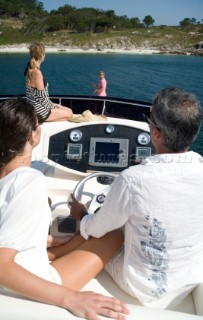 Four people on powerboat