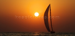 LOUIS VUITTON TROPHY, DUBAI, UNITED ARAB EMIRATES, NOVEMBER 20TH 2010:  Sails of the IACC yachts at sunset.  Louis Vuitton Trophy in Dubai (12 - 27 November 2010).