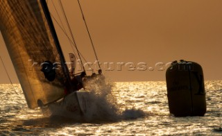 LOUIS VUITTON TROPHY, DUBAI, UNITED ARAB EMIRATES, NOVEMBER 20TH 2010:  Sails of the IACC yachts at sunset.  Louis Vuitton Trophy in Dubai (12 - 27 November 2010).