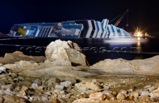 The passenger cruise ship Costa Concordia hit rocks and ran aground at 9.45pm on the Island of Giglio on January 13th 2012. The wrecked ship lays on a reef heeled on its side.