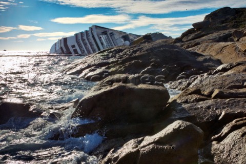 The passenger cruise ship Costa Concordia hit rocks and ran aground at 945pm on the Island of Giglio