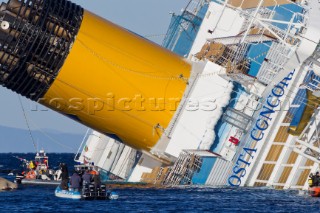 The passenger cruise ship Costa Concordia hit rocks and ran aground at 9.45pm on the Island of Giglio on January 13th 2012. The wrecked ship lays on a reef heeled on its side.