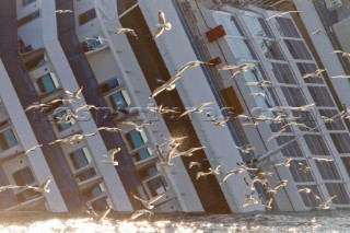 The passenger cruise ship Costa Concordia hit rocks and ran aground at 9.45pm on the Island of Giglio on January 13th 2012. The wrecked ship lays on a reef heeled on its side.