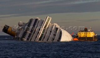 The passenger cruise ship Costa Concordia hit rocks and ran aground at 9.45pm on the Island of Giglio on January 13th 2012. The wrecked ship lays on a reef heeled on its side.