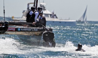 Cascais 06-08-2011  AMERICAS CUP WORLD SERIES CASCAIS  ETNZ bowman Winston MacFarlane pitched into the water when a winch handle broke as he was grinding in the gennaker at the second mark