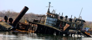 New York - 09/04/2008  Staten Island Boat Graveyard  Off the shore of Staten Island New York rests a veritable graveyard of decommissioned, scrapped, and abandoned ships of various sizes, ages, and states of decay.